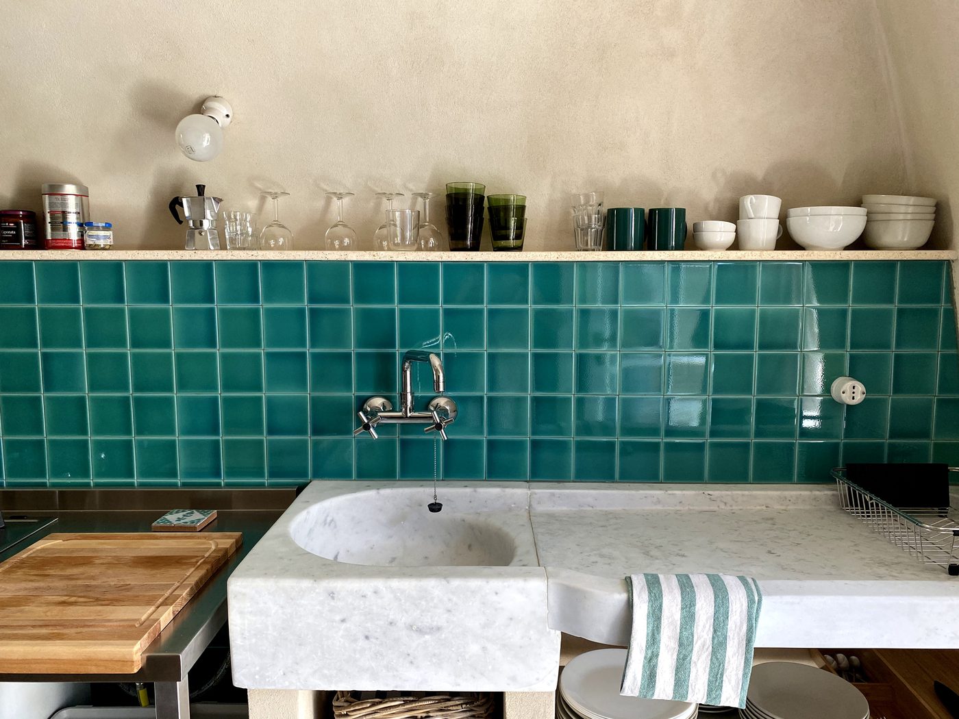 Kitchen sink with teal handmade tiles at Ca' Remurin, Verezzi, Liguria